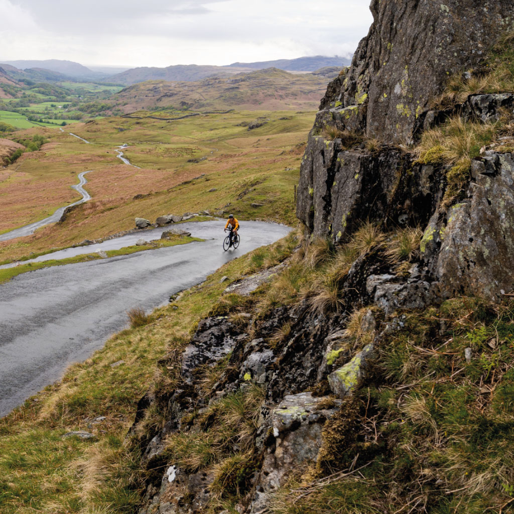 A Photo of Gavin Towers cycling up a steep hill